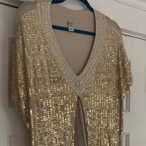 Sequin Gold top with open sides .